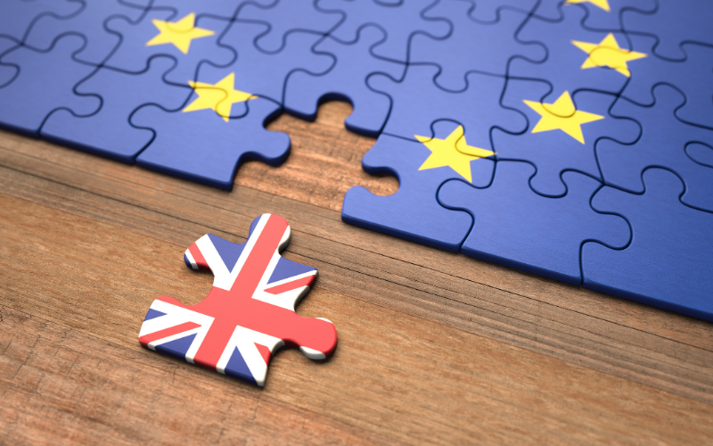 Jigsaw making up the logo for the EU, with the Union Jack not in the jigsaw to represent Brexit