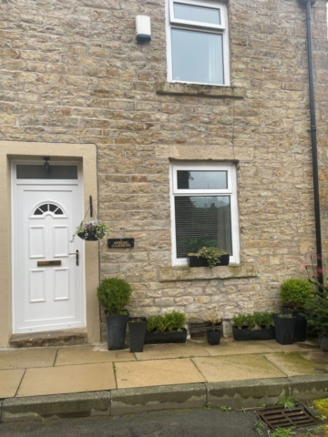 Front door of a 2 bedroom property available to rent with The Lettings Cloud located on Spring Gardens Terrace, Padiham